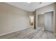 Bedroom with a closet with mirrored doors and an open doorway to the ensuite bathroom at 7530 Brisa Del Mar Ave, Las Vegas, NV 89179