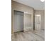 Bedroom with an open closet and gray wood-look floors at 7530 Brisa Del Mar Ave, Las Vegas, NV 89179
