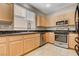 Efficient kitchen features stainless steel appliances, granite countertops, and ample natural light from the window at 7530 Brisa Del Mar Ave, Las Vegas, NV 89179