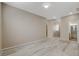 Spacious living room showcasing wood-look floors and recessed lighting at 7530 Brisa Del Mar Ave, Las Vegas, NV 89179