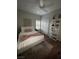 Comfortable bedroom with a ceiling fan, stylish decorations, and hardwood floors at 8250 N Grand Canyon Dr # 1036, Las Vegas, NV 89166