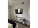 Modern bedroom featuring mounted TV, console table, and stylish decor at 8250 N Grand Canyon Dr # 1036, Las Vegas, NV 89166