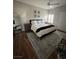 Stylized bedroom with modern decor, wood floors, and a comfortable queen-sized bed at 8250 N Grand Canyon Dr # 1036, Las Vegas, NV 89166