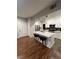 Well-lit kitchen with a large island, modern appliances, and stylish pendant lighting at 8250 N Grand Canyon Dr # 1036, Las Vegas, NV 89166