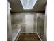 Bright bathroom featuring a soaking tub and separate glass-enclosed shower at 8255 Las Vegas Blvd # 711, Las Vegas, NV 89123