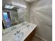 Double sink bathroom vanity and large mirror with overhead lighting at 8255 Las Vegas Blvd # 711, Las Vegas, NV 89123