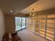 Bedroom featuring carpet, a sliding glass door leading to a balcony, and built-in shelving at 8255 Las Vegas Blvd # 711, Las Vegas, NV 89123