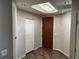 Hallway with hardwood floors leading to closet and an exterior door at 8255 Las Vegas Blvd # 711, Las Vegas, NV 89123