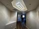 Hallway with a decorative light fixture in the ceiling and hardwood floors at 8255 Las Vegas Blvd # 711, Las Vegas, NV 89123