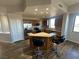 Kitchen featuring an island with seating, stainless steel appliances and wood cabinets at 8255 Las Vegas Blvd # 711, Las Vegas, NV 89123