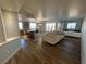 Spacious open floor plan with city views, hardwood floors, kitchen, and seating area at 8255 Las Vegas Blvd # 711, Las Vegas, NV 89123