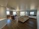 Spacious open floor plan with city views, hardwood floors, kitchen, and seating area at 8255 Las Vegas Blvd # 711, Las Vegas, NV 89123