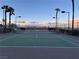 This outdoor tennis court has a net and is ready for a game at 8255 Las Vegas Blvd # 711, Las Vegas, NV 89123
