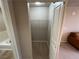 Hallway view of walk-in closet with wire rack shelving and light at 8255 Las Vegas Blvd # 711, Las Vegas, NV 89123
