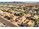 Real estate listing showing an aerial view of residential homes with red tiled roofs in a well-maintained neighborhood at 841 Glitter Glen Ct, Las Vegas, NV 89123
