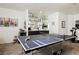 Entertainment space includes a ping pong table and a stylish bar area with mirrored shelving at 841 Glitter Glen Ct, Las Vegas, NV 89123