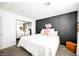 Comfortable bedroom featuring a paneled accent wall, with lots of light and a calm relaxing atmosphere at 841 Glitter Glen Ct, Las Vegas, NV 89123