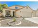 Charming two-story home featuring a well-manicured front yard and three-car garage at 841 Glitter Glen Ct, Las Vegas, NV 89123