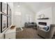 Inviting living room with a fireplace, plush seating, and stylish design at 841 Glitter Glen Ct, Las Vegas, NV 89123