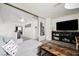 Relaxing living room showcasing stylish décor, comfortable seating, and mirrored closet at 841 Glitter Glen Ct, Las Vegas, NV 89123
