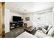 Comfortable living room with plush seating, TV, stylish coffee table, and natural light at 841 Glitter Glen Ct, Las Vegas, NV 89123