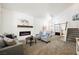 Bright living room featuring a fireplace, modern décor, and an open floor plan at 841 Glitter Glen Ct, Las Vegas, NV 89123