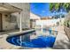 Beautiful backyard featuring a private pool, hot tub, and lounging area for relaxation and entertainment at 841 Glitter Glen Ct, Las Vegas, NV 89123