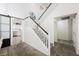 Bright staircase leading to the upper level, adjacent to kitchen and dining areas at 841 Glitter Glen Ct, Las Vegas, NV 89123