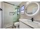 Updated bathroom with glass enclosed shower and modern lighting at 9272 W Viking Rd, Las Vegas, NV 89147