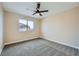 Comfortable bedroom with plush carpeting and ceiling fan at 9272 W Viking Rd, Las Vegas, NV 89147
