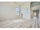 Bright living room with hardwood floors, soaring ceilings, large windows and neutral paint scheme at 9272 W Viking Rd, Las Vegas, NV 89147