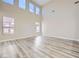 Spacious living room featuring high ceilings and luxury vinyl plank flooring at 9272 W Viking Rd, Las Vegas, NV 89147
