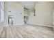 Bright living room featuring hardwood floors, soaring ceilings, a staircase, and neutral paint scheme at 9272 W Viking Rd, Las Vegas, NV 89147