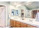 Bright bathroom with double sinks, large mirror, and separate shower at 9378 Chateau St Jean Dr, Las Vegas, NV 89123
