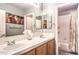 Bathroom with double sinks, white countertops, and a shower-tub combo at 9378 Chateau St Jean Dr, Las Vegas, NV 89123