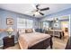 This bedroom features a closet with mirrored doors, a ceiling fan and great natural light at 9378 Chateau St Jean Dr, Las Vegas, NV 89123