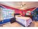 Unique bedroom with colorful walls, a comfortable bed, and large windows for natural light at 9378 Chateau St Jean Dr, Las Vegas, NV 89123
