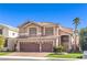 Charming two-story home with a three-car garage, tile roof, and well-maintained lawn at 9378 Chateau St Jean Dr, Las Vegas, NV 89123