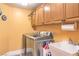 Bright laundry room with stainless steel washer and dryer and plenty of storage at 9378 Chateau St Jean Dr, Las Vegas, NV 89123