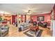 Open-concept living area with hardwood floors, cozy seating, and access to the kitchen at 9378 Chateau St Jean Dr, Las Vegas, NV 89123