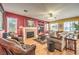 Comfortable living room with a cozy fireplace, hardwood floors, and warm, inviting colors at 9378 Chateau St Jean Dr, Las Vegas, NV 89123