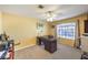 This home office features a large desk, bright paint and lots of natural light at 9378 Chateau St Jean Dr, Las Vegas, NV 89123
