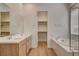 Bright bathroom with double vanity, soaking tub, and walk-in closet at 97 Sarabeth St, Las Vegas, NV 89138