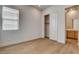 Well-lit bedroom with a closet, wood floors, and a window offering comfortable living space at 97 Sarabeth St, Las Vegas, NV 89138