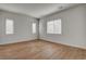 Bright bedroom with wood flooring and three windows at 97 Sarabeth St, Las Vegas, NV 89138
