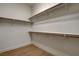 Spacious walk-in closet with wood shelving, provides ample space for organized storage at 97 Sarabeth St, Las Vegas, NV 89138