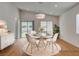 Dining area with a stylish round table and abundant natural light at 97 Sarabeth St, Las Vegas, NV 89138