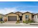 Charming single-story home featuring a two-car garage and low maintenance desert landscaping at 97 Sarabeth St, Las Vegas, NV 89138