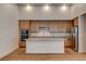 Modern kitchen featuring an island, stainless steel appliances, and hardwood flooring at 97 Sarabeth St, Las Vegas, NV 89138