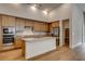 Spacious kitchen featuring a kitchen island, stainless steel appliances, and wooden cabinets at 97 Sarabeth St, Las Vegas, NV 89138
